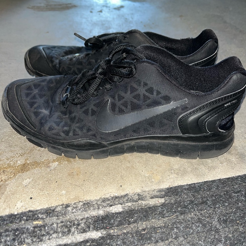 All black Nike shoes